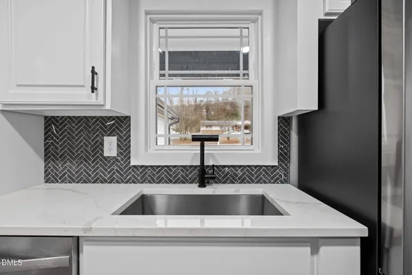a kitchen with a stove and a microwave