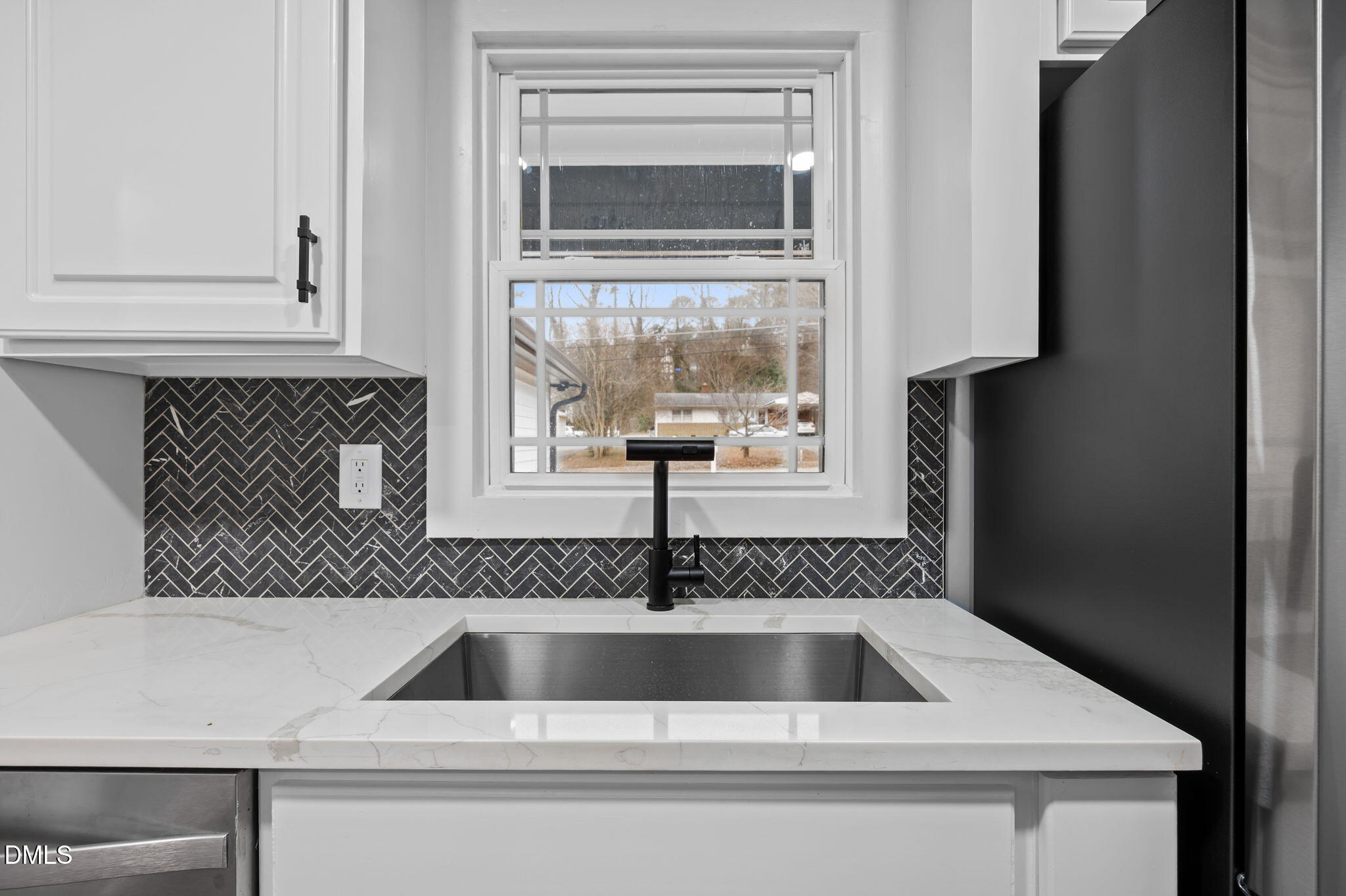 3000 Brentwood Road Raleigh, NC 27604 - Photo 18 of 41 a kitchen with a sink and cabinets