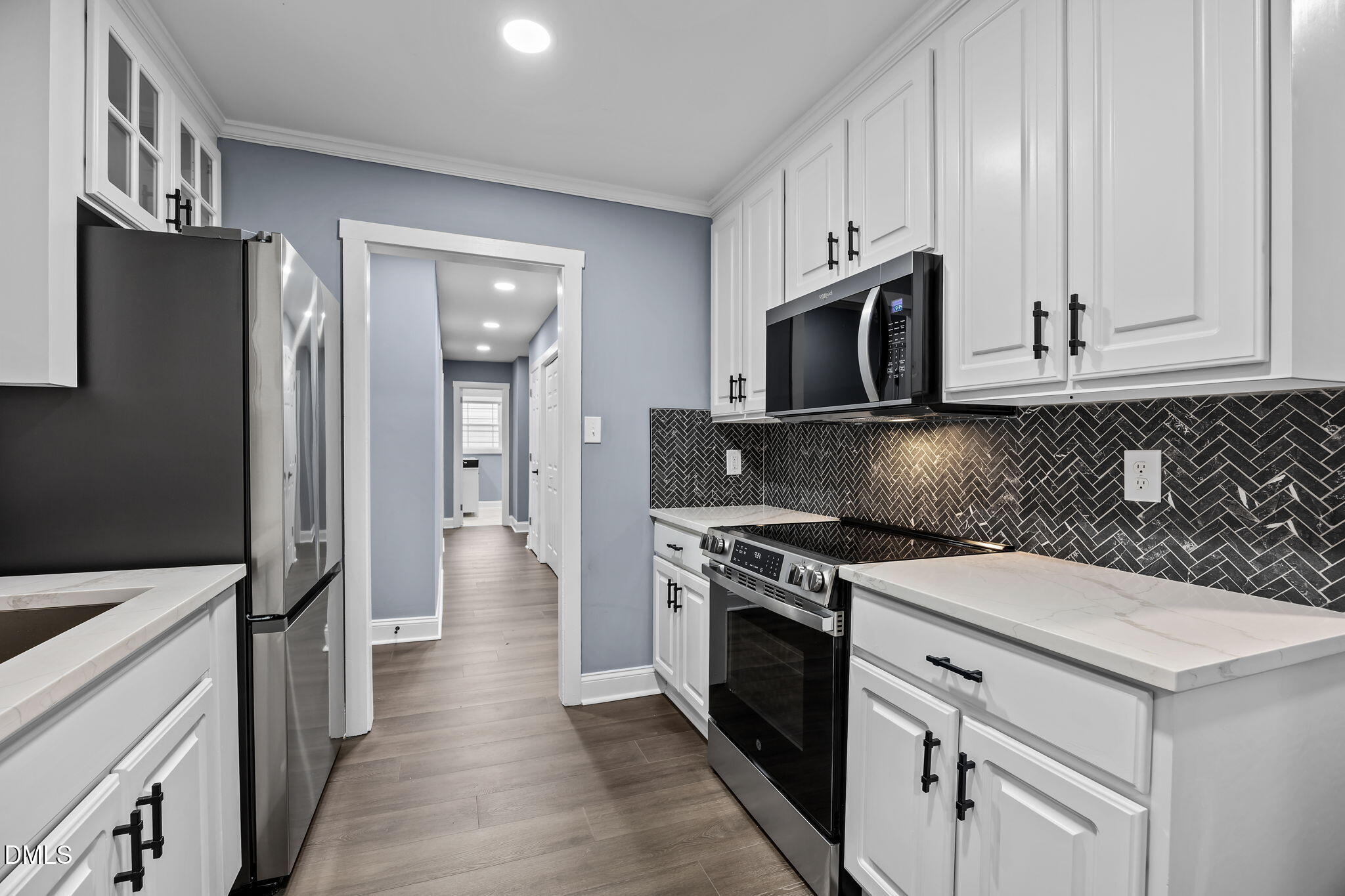 3000 Brentwood Road Raleigh, NC 27604 - Photo 19 of 41 a kitchen with a stove and a microwave