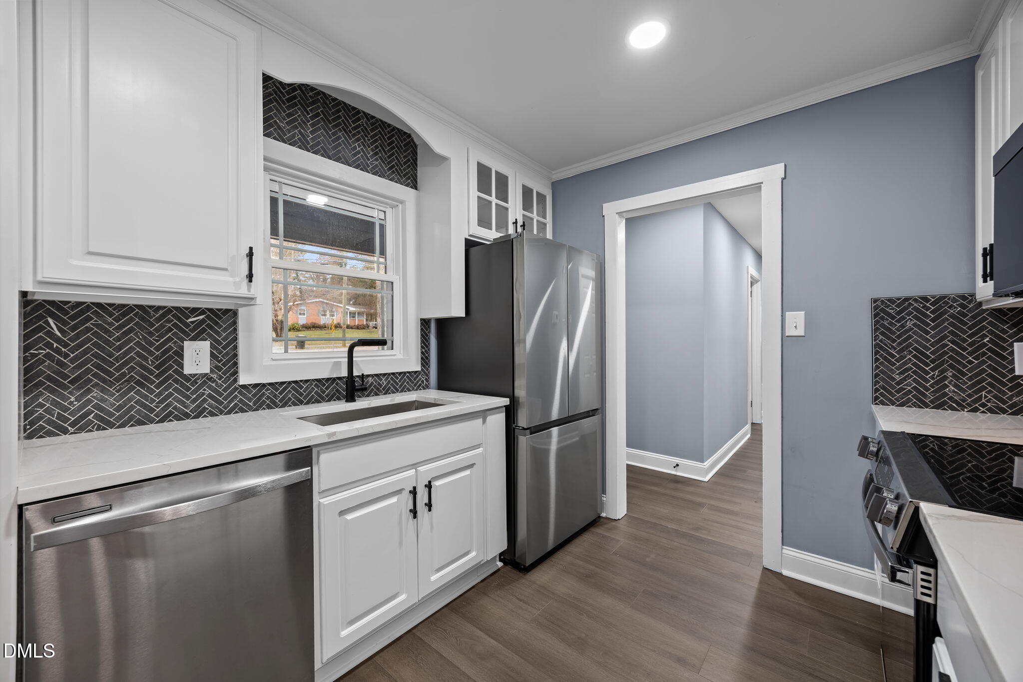 3000 Brentwood Road Raleigh, NC 27604 - Photo 20 of 41 a kitchen with stainless steel appliances granite countertop a refrigerator sink and cabinets