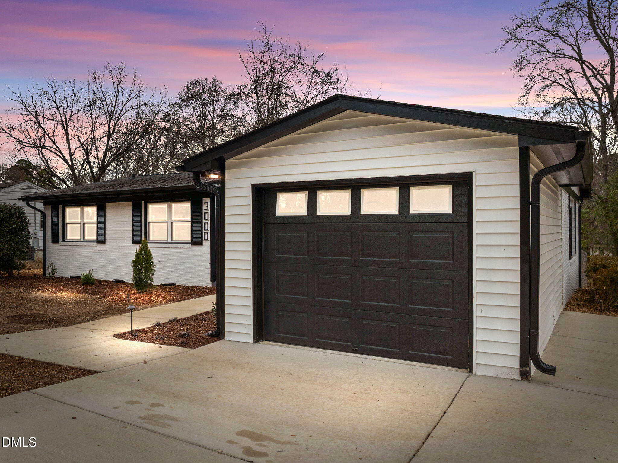 3000 Brentwood Road Raleigh, NC 27604 - Photo 2 of 41 a front view of a house with a yard