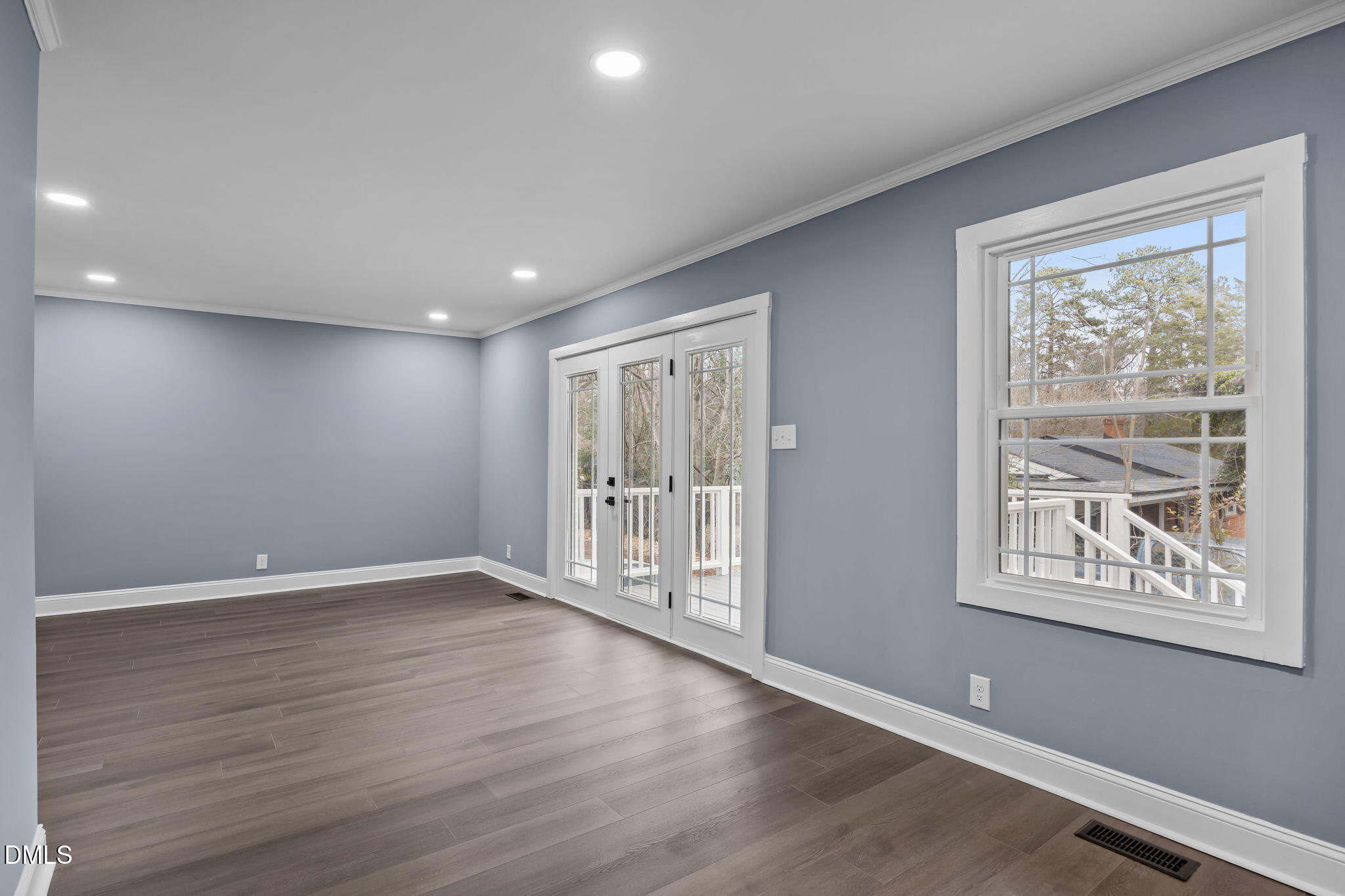 3000 Brentwood Road Raleigh, NC 27604 - Photo 24 of 44 a view of an empty room with wooden floor and a window