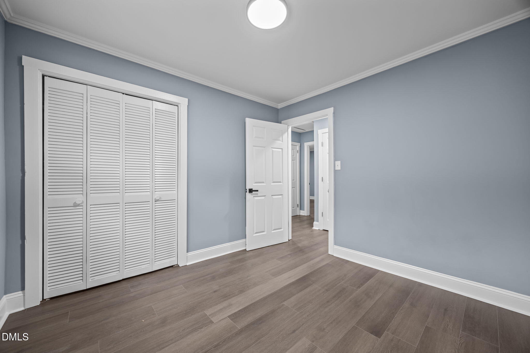 3000 Brentwood Road Raleigh, NC 27604 - Photo 32 of 44 a view of an empty room with wooden floor