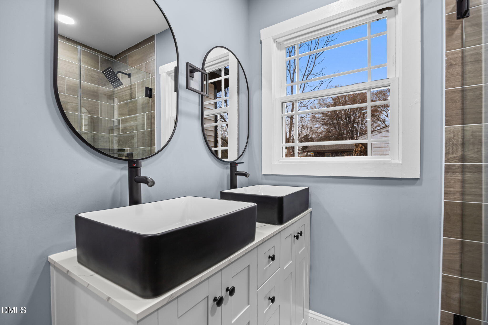 3000 Brentwood Road Raleigh, NC 27604 - Photo 35 of 44 a bathroom with a sink and a mirror