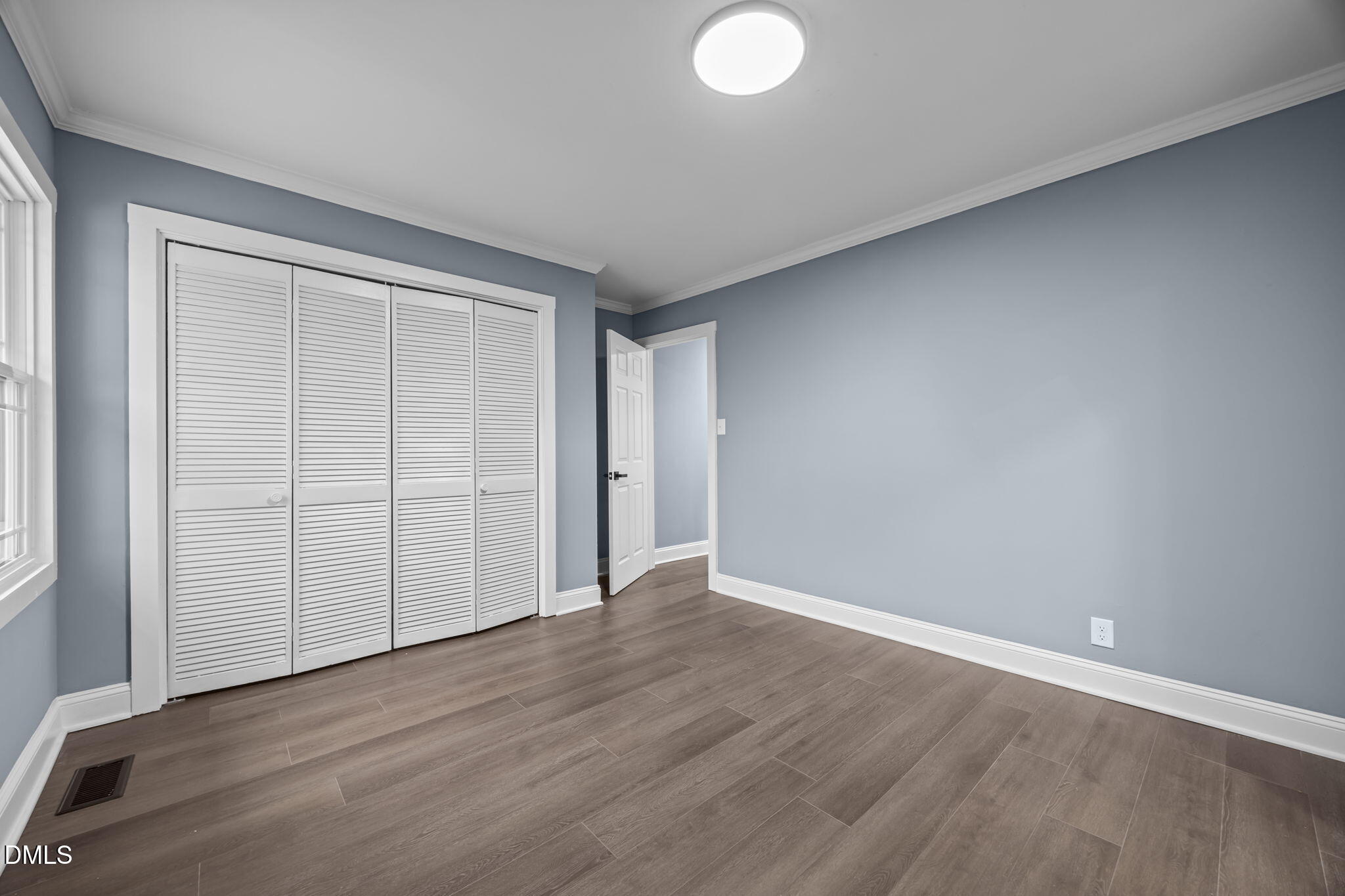 3000 Brentwood Road Raleigh, NC 27604 - Photo 39 of 44 a view of an empty room with wooden floor