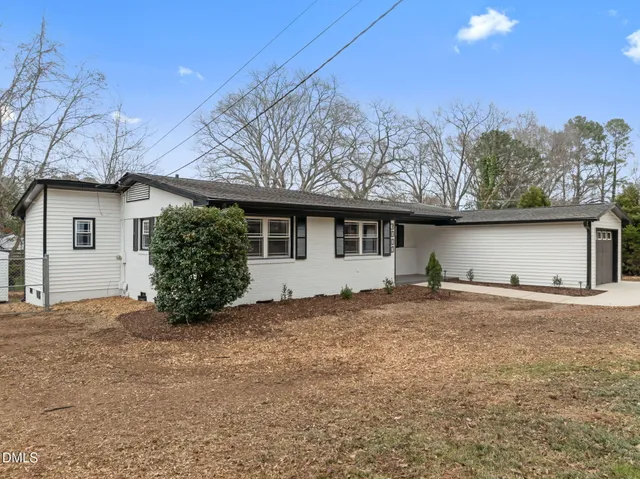 a house with trees in the background