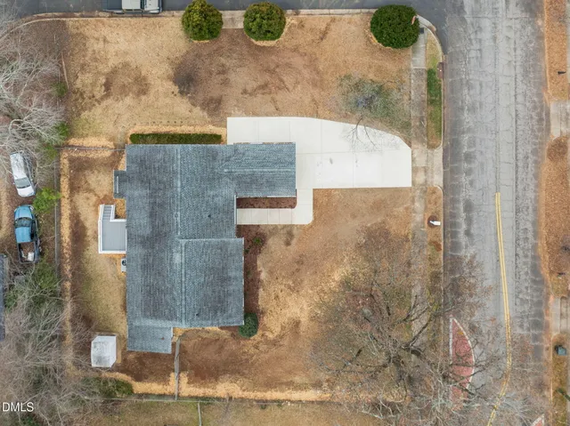 a bathroom with a granite countertop shower a sink and a mirror