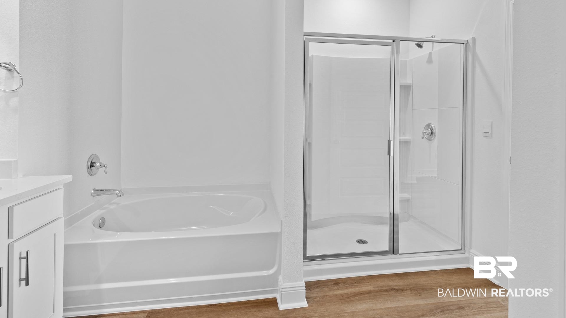 12931 Grand Rpds Road Fairhope, AL 36532 - Photo 25 of 33 Bathroom featuring an enclosed shower, wood finished floors, vanity, and a bath