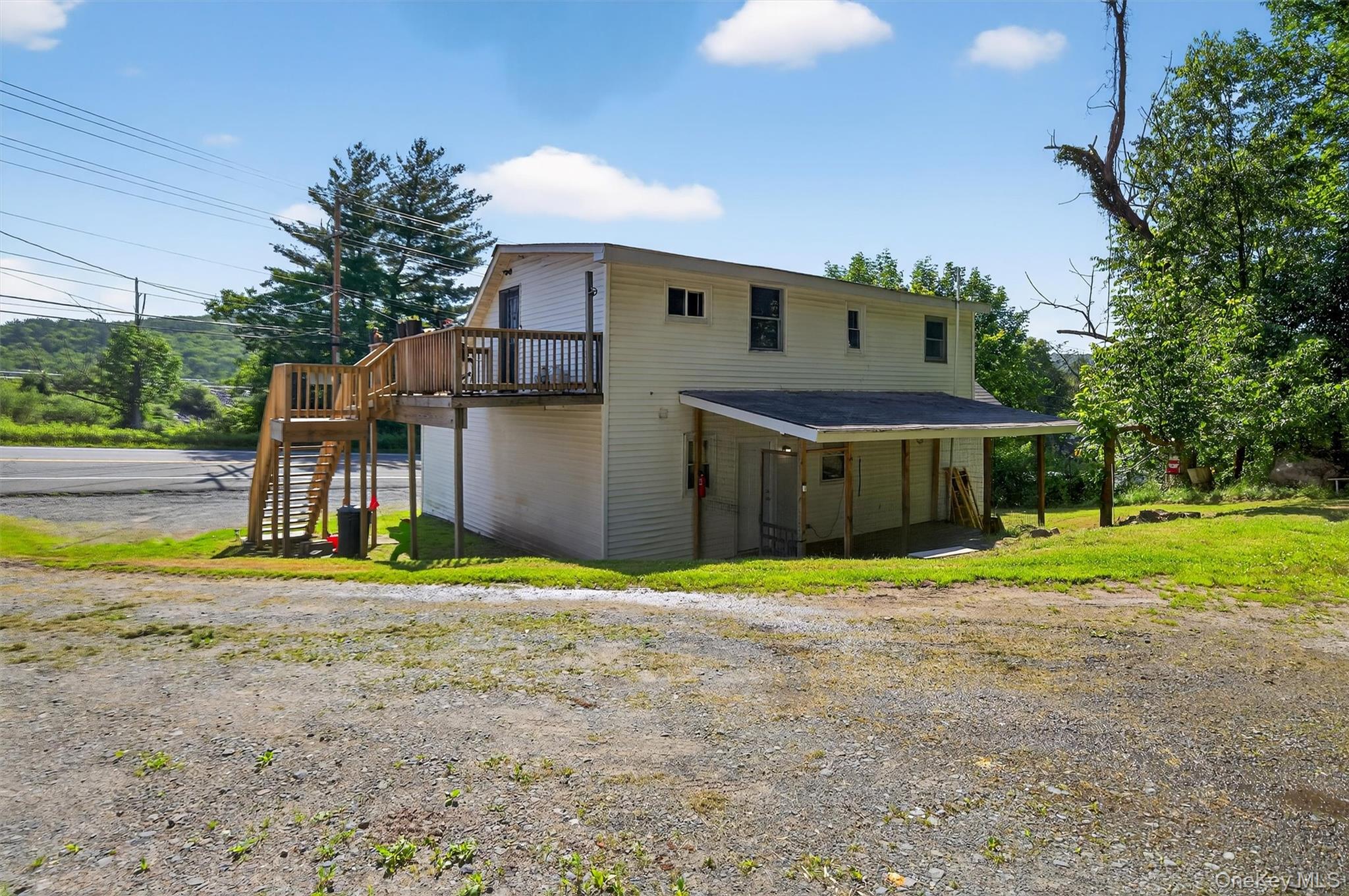 376 Bridgeville Road, Unit 1 Monticello, NY 12701 - Photo 16 of 17 Back of house with a deck and stairs to occupied unit above