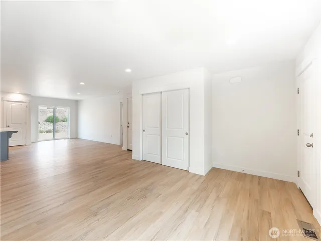 a view of a livingroom with wooden floor