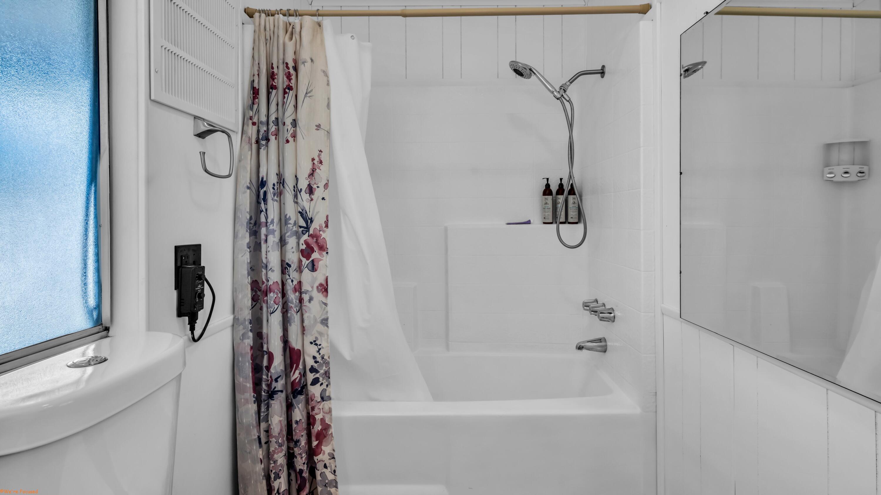 74711 Dillon Road, Unit 392 Desert Hot Springs, CA 92241 - Photo 16 of 46 a bathroom with a bath tub with a shower