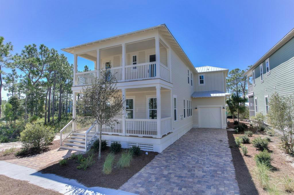 43 Flatwoods Forest Loop Santa Rosa Beach, FL 32459 - Photo 1 of 25 a front view of a house with garden