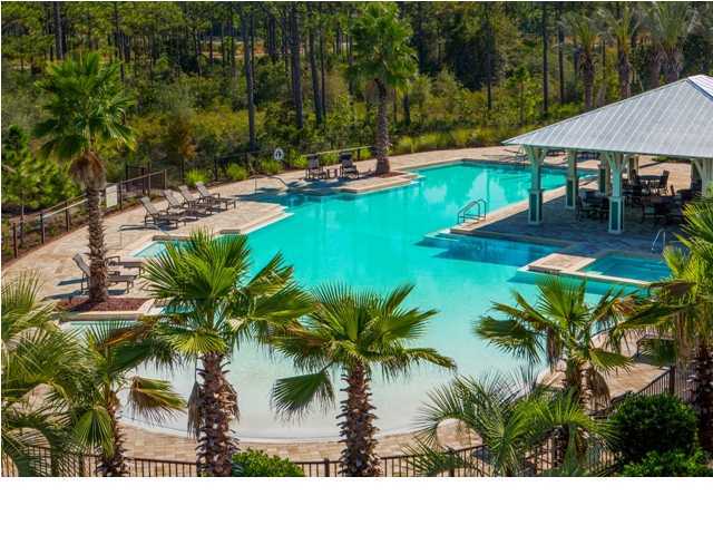 43 Flatwoods Forest Loop Santa Rosa Beach, FL 32459 - Photo 12 of 25 a view of swimming pool with lawn chairs and plants