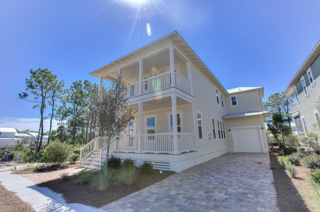 43 Flatwoods Forest Loop Santa Rosa Beach, FL 32459 - Photo 2 of 25 a front view of a house with a yard