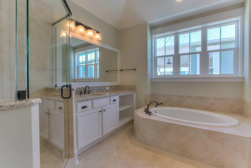 43 Flatwoods Forest Loop Santa Rosa Beach, FL 32459 - Photo 7 of 25 a spacious bathroom with a granite countertop tub and a sink