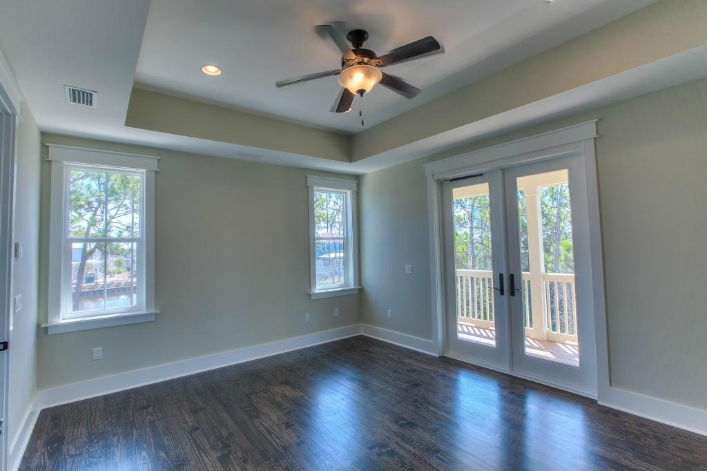 43 Flatwoods Forest Loop Santa Rosa Beach, FL 32459 - Photo 9 of 25 a view of an empty room with wooden floor and a window