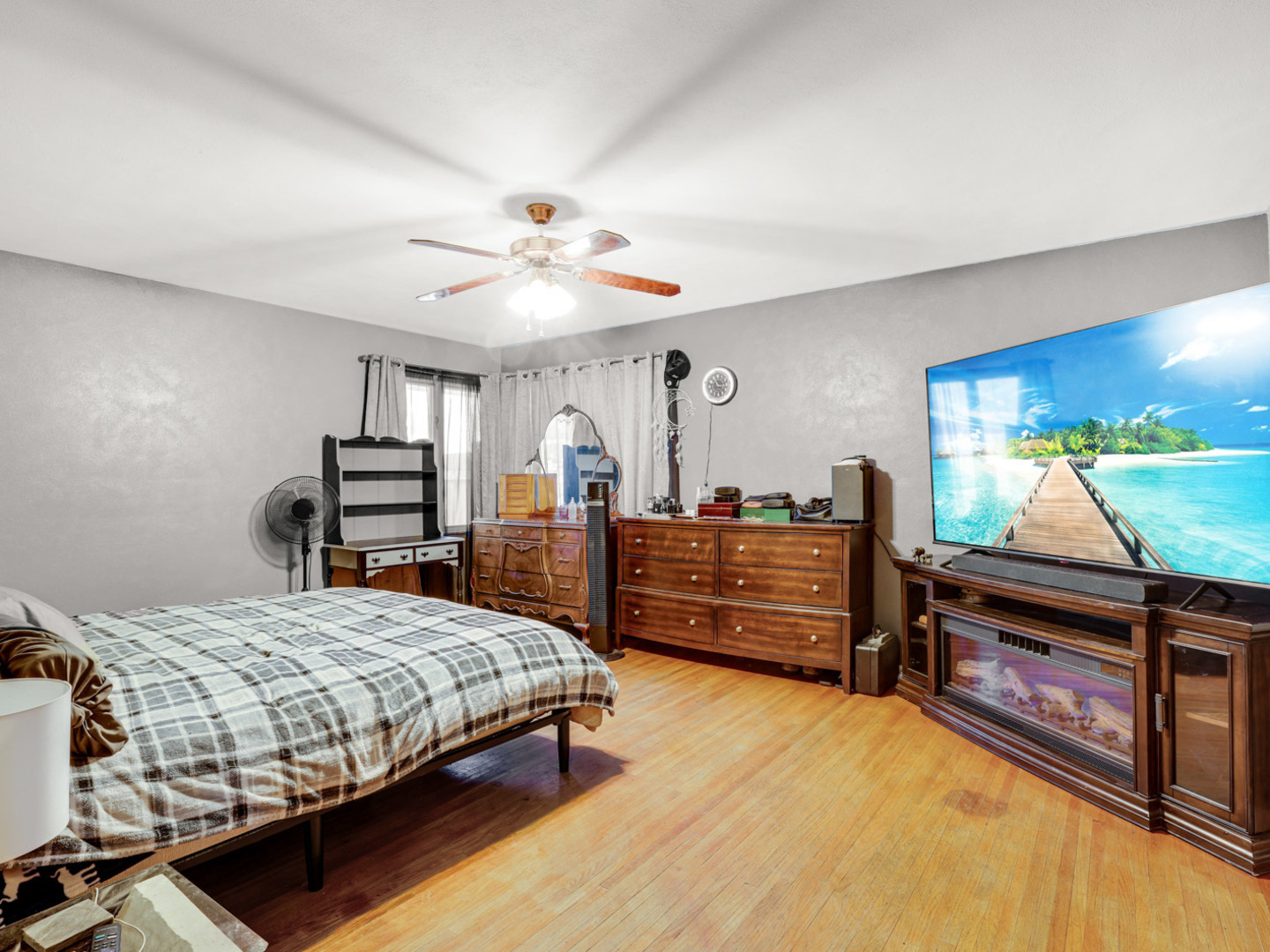 1600 Black Road Joliet, IL 60435 - Photo 11 of 22 a bedroom with a bed and a flat screen tv