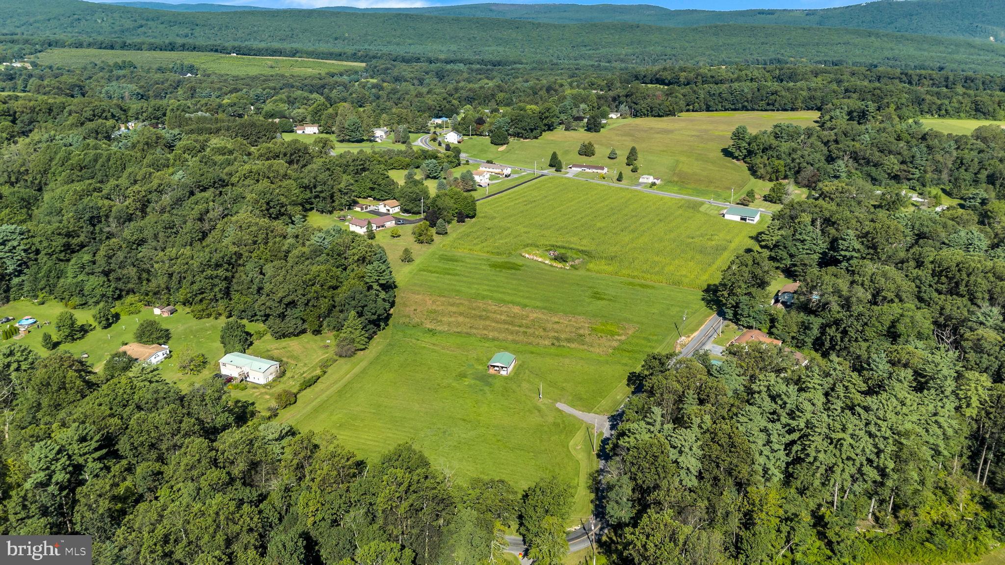 Expansive green fields embrace serene landscapes.