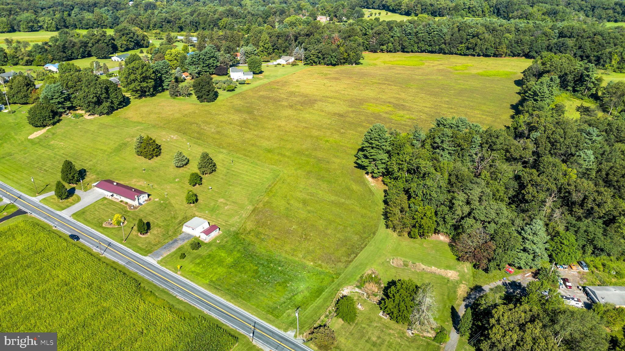 Sprawling green fields meet serene landscapes.