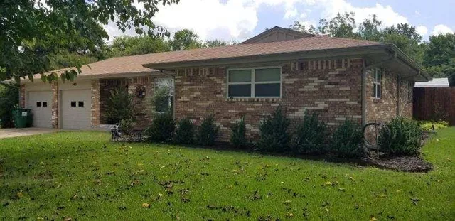 a backyard of a house with lots of green space