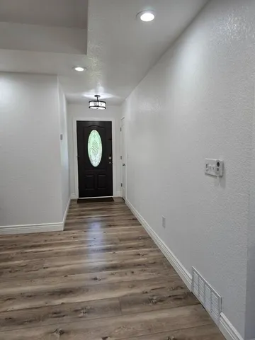 a view of entryway with wooden floor