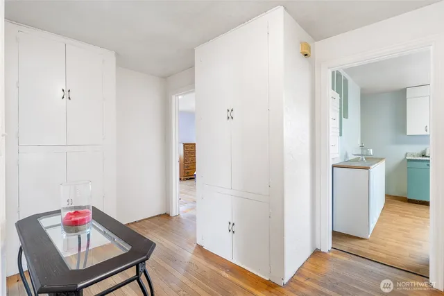 a view of kitchen with furniture and wooden floor