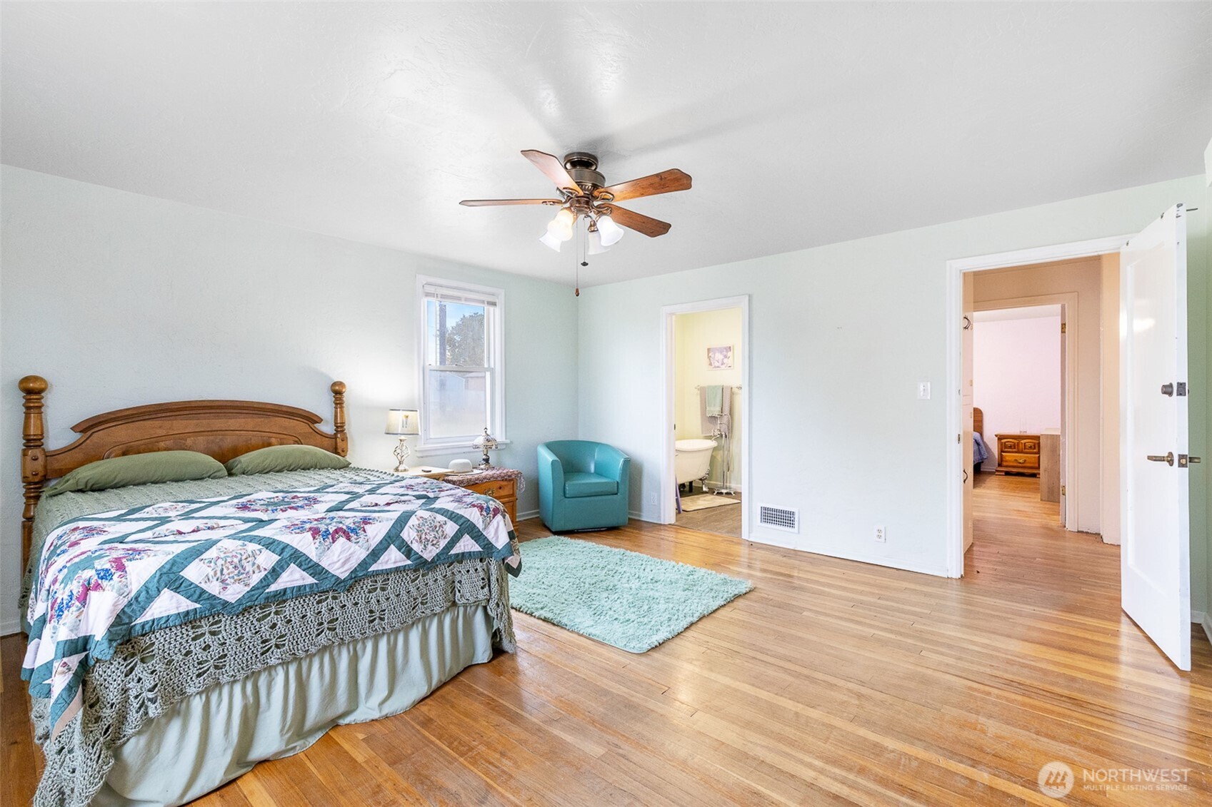 32105 South Finley Road Kennewick, WA 99337 - Photo 11 of 34 a bedroom with a bed and wooden floor