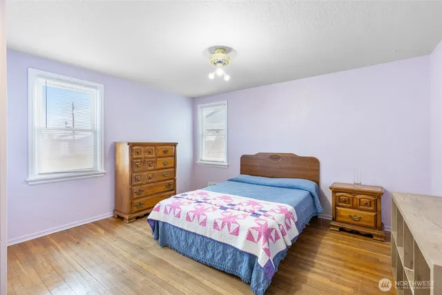 a bedroom with a bed and a closet