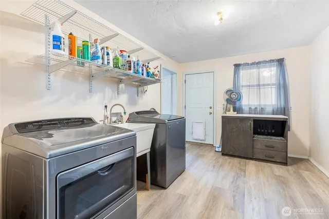 a kitchen with a stove and a refrigerator