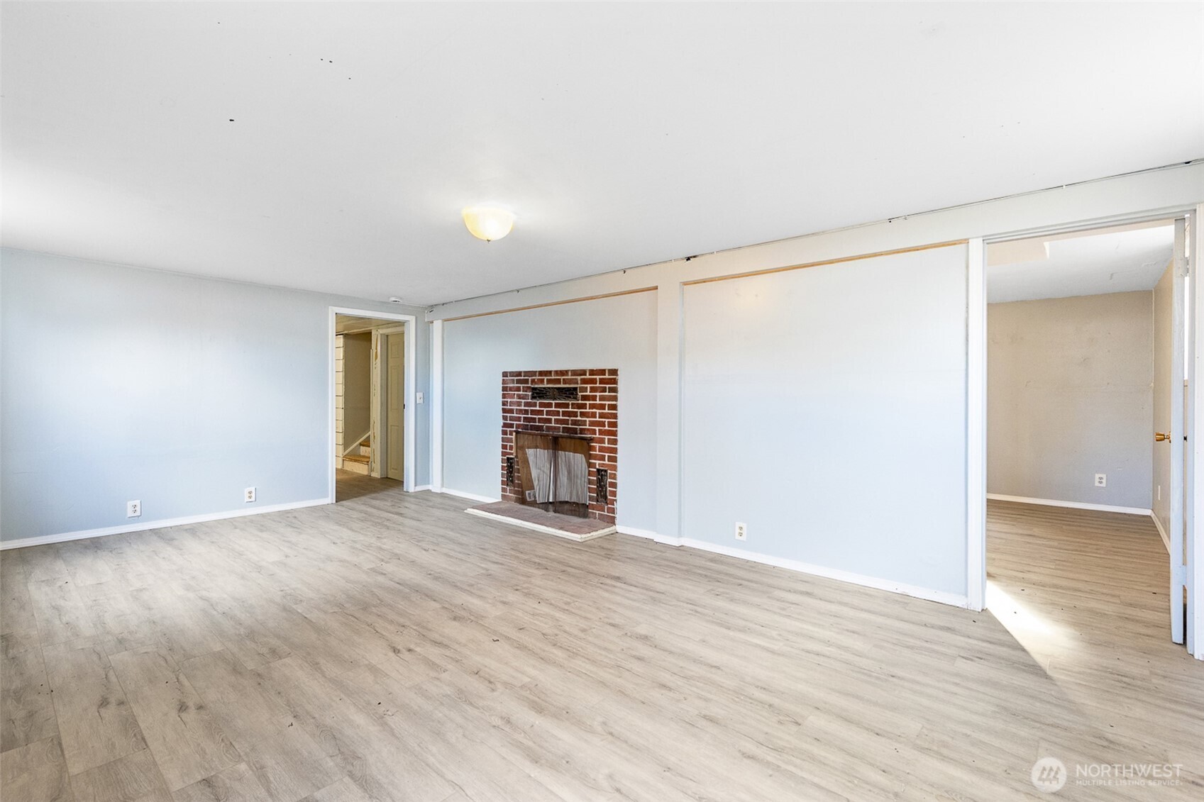 32105 South Finley Road Kennewick, WA 99337 - Photo 20 of 34 an empty room with wooden floor and windows