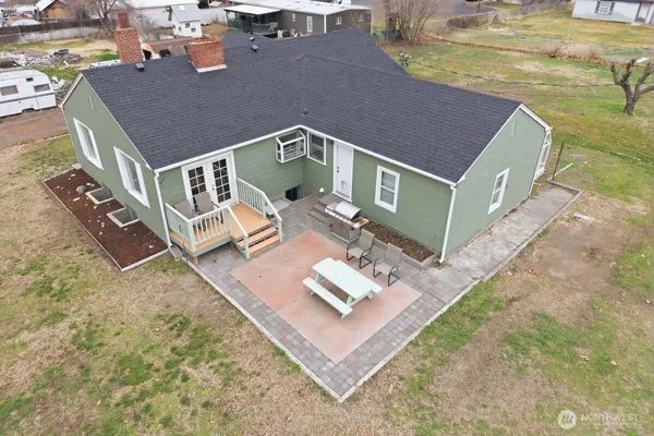 a aerial view of a house with a yard
