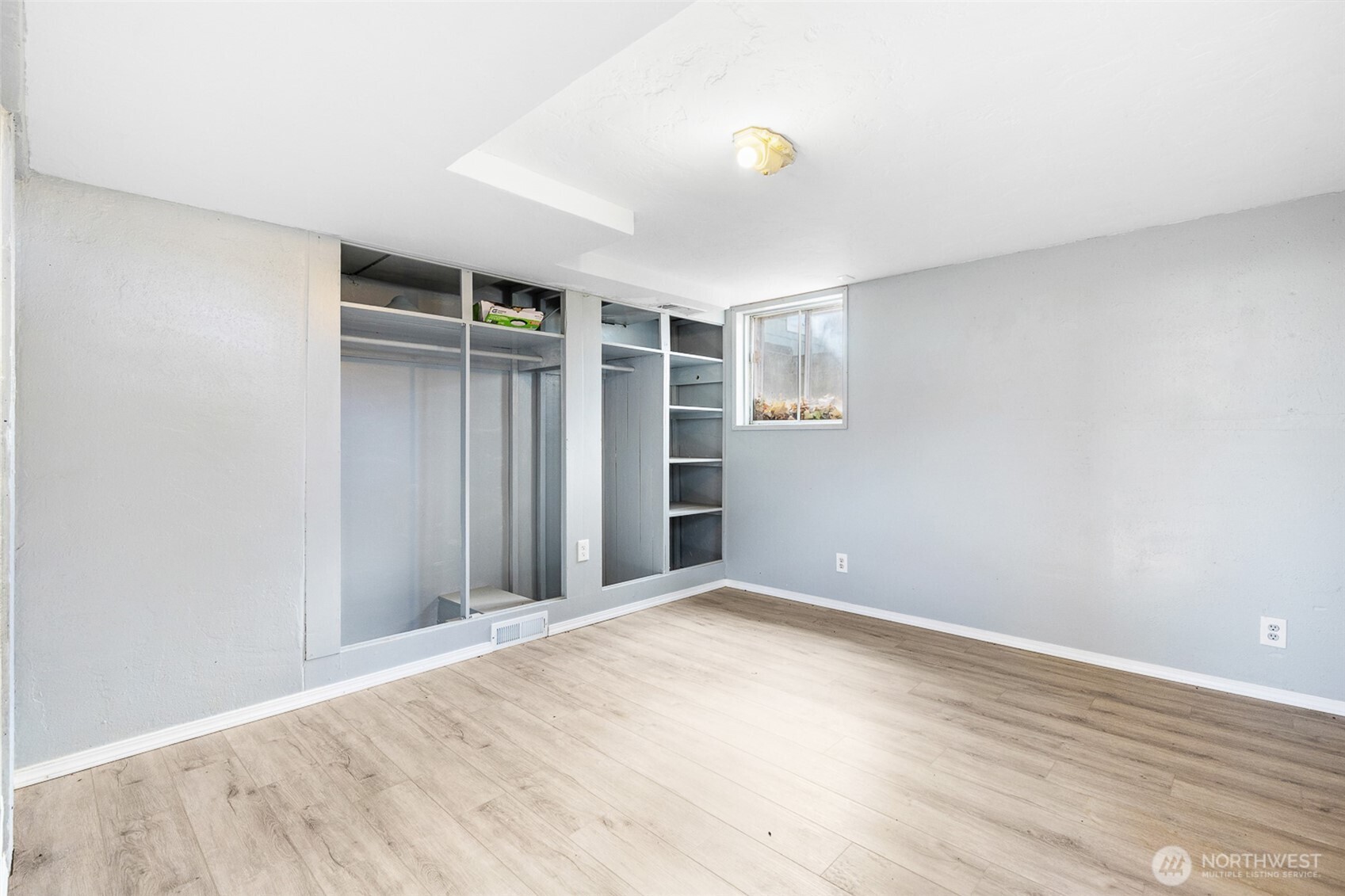 32105 South Finley Road Kennewick, WA 99337 - Photo 22 of 34 wooden floor in an empty room with a window