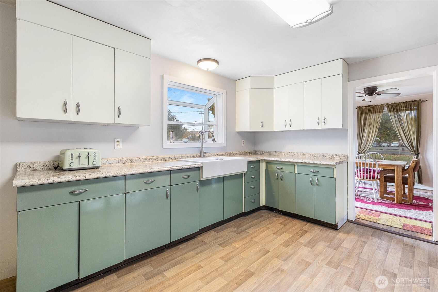 32105 South Finley Road Kennewick, WA 99337 - Photo 3 of 34 a kitchen with a sink cabinets and a window