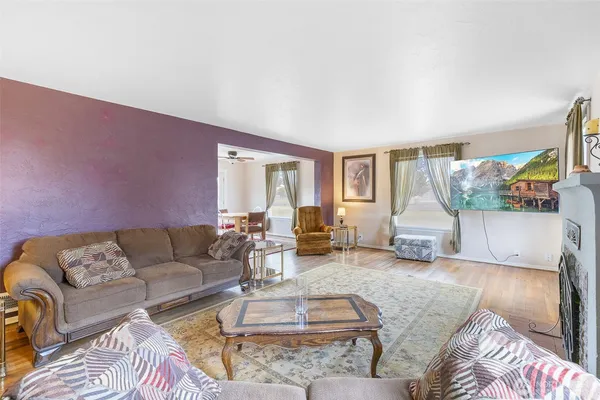 a living room with furniture and a table