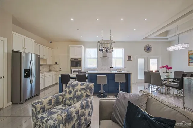 a large kitchen with a table and chairs