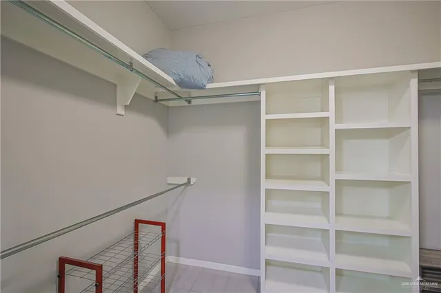 a view of an empty walk in closet