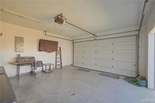 a view of empty room with windows and cabinet