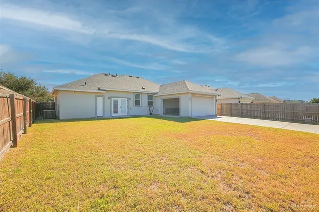 a house with a swimming pool in front of it