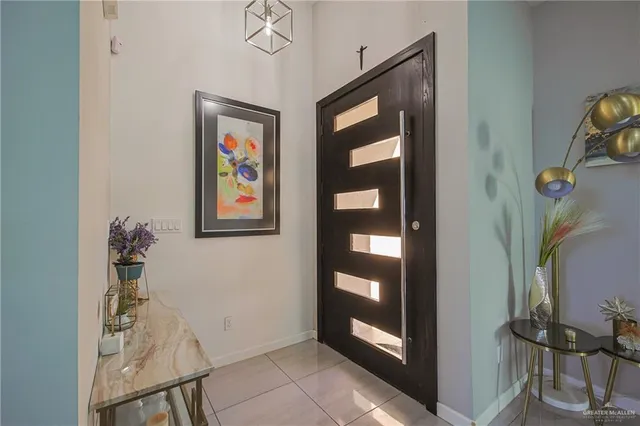 a view of an entryway with wooden floor