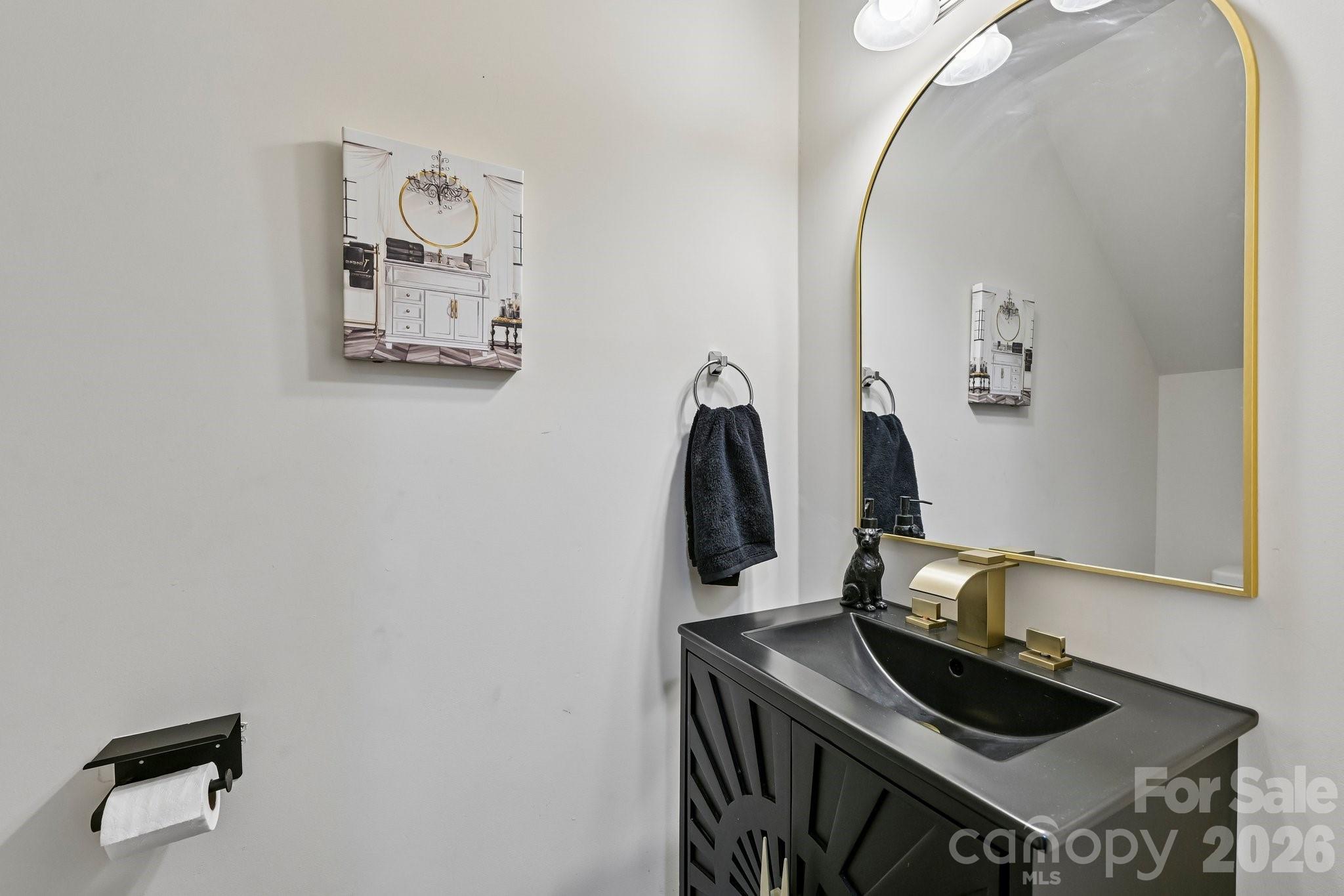 2206 Turtle Point Road Charlotte, NC 28262 - Photo 14 of 28 a bathroom with a sink and a mirror