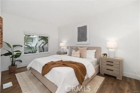 a bedroom with a bed and window