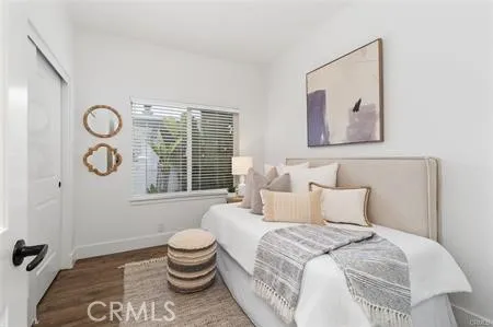 a bedroom with a bed and a table with chair