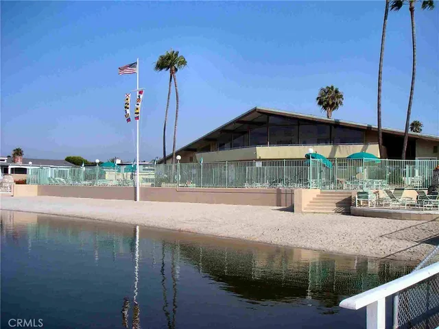 a small pool with a table and chairs