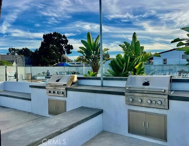 a kitchen with stainless steel appliances kitchen island a stove and a cabinets