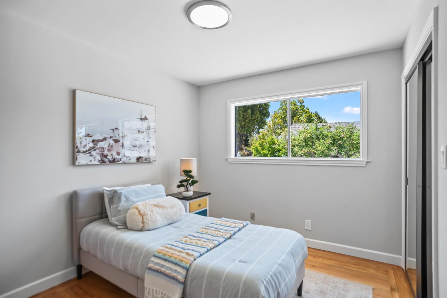 967 Chelan Drive Sunnyvale, CA 94087 - Photo 14 of 38 a bedroom with a bed and a window