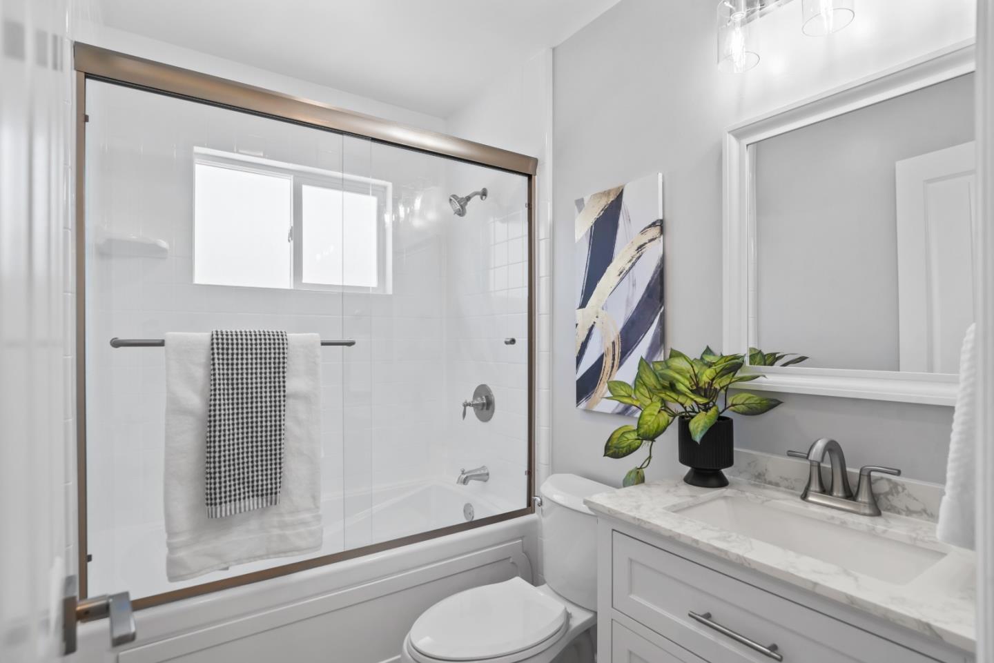 967 Chelan Drive Sunnyvale, CA 94087 - Photo 15 of 38 a bathroom with a granite countertop sink a toilet and shower