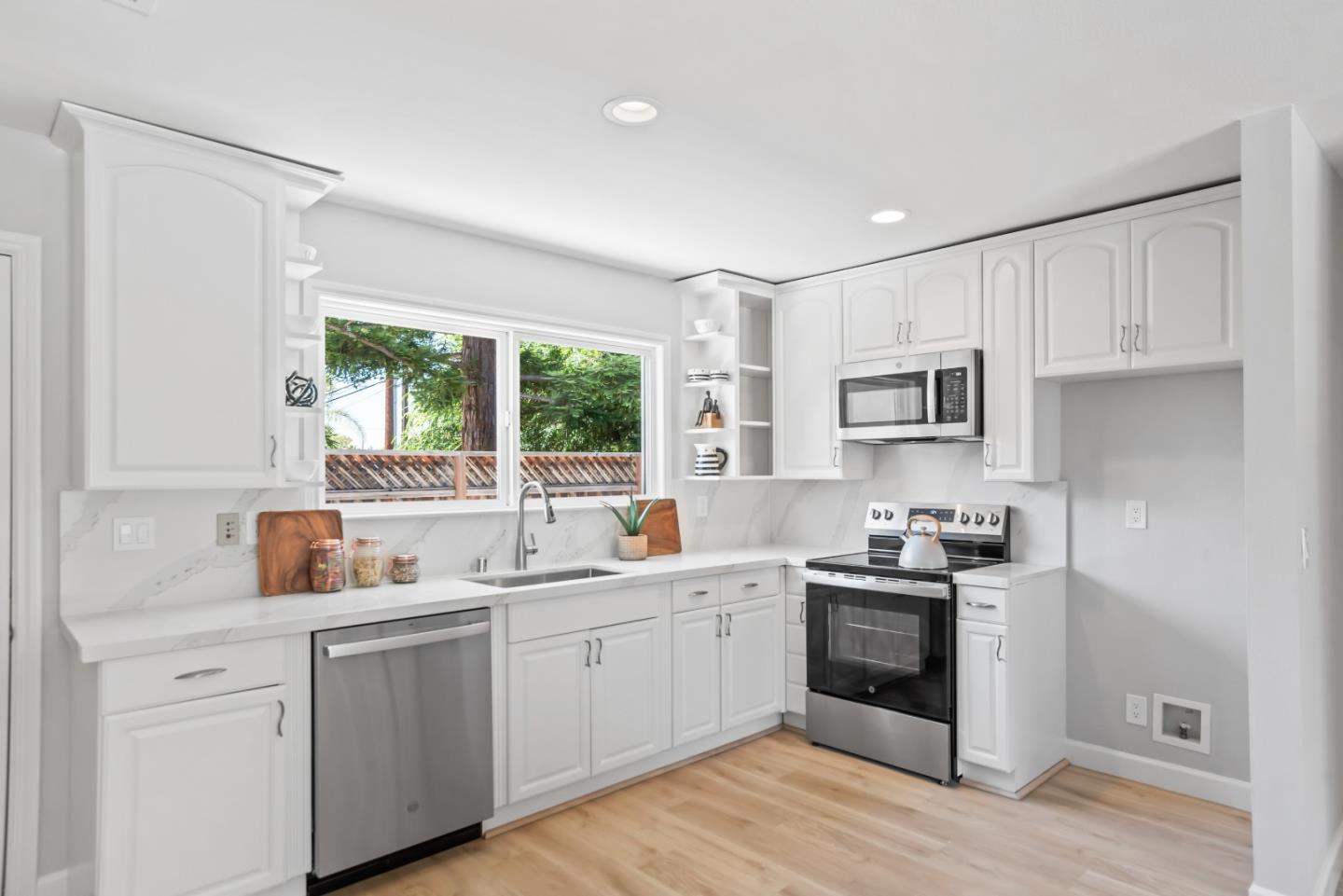 967 Chelan Drive Sunnyvale, CA 94087 - Photo 22 of 38 a kitchen with a sink stove and cabinets
