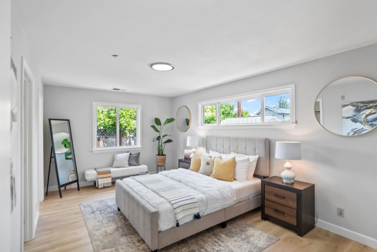 967 Chelan Drive Sunnyvale, CA 94087 - Photo 27 of 38 a bed room with a bed a mirror and a large window