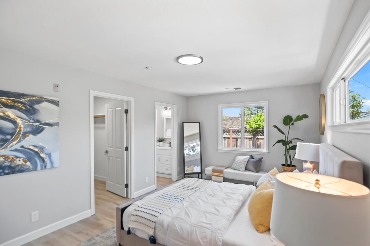 967 Chelan Drive Sunnyvale, CA 94087 - Photo 28 of 38 a spacious bedroom with a bed and a couch