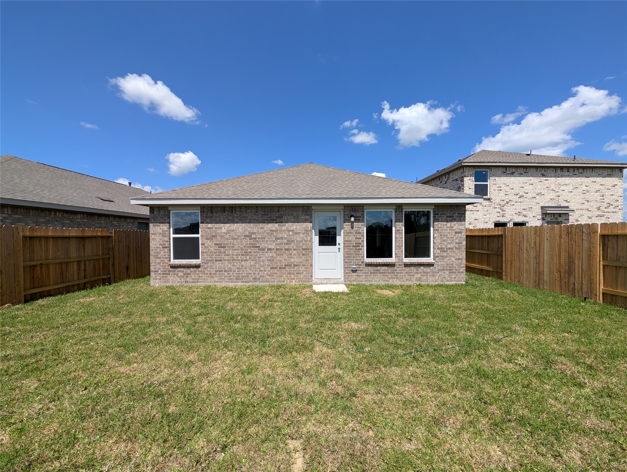 2923 Summer Breeze Way Angleton, TX 77515 - Photo 8 of 16 a backyard of a house with a garden and barbeque oven